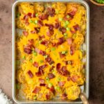 These twice baked smashed potatoes are everyone's favorite classic summer side dish made with crispy smashed potatoes baked on a sheet pan and topped with cheddar cheese and bacon. This recipe is perfect for a weeknight dinner side but also great to serve to a crowd.