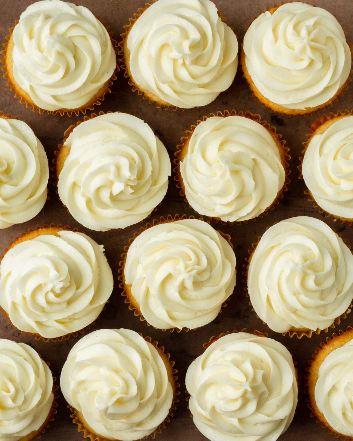 These vanilla cupcakes are deliciously soft homemade cupcakes with a rich vanilla flavor and topped with smooth and creamy buttercream frosting.