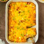 This bacon tater tot breakfast casserole is a flavorful and filling homemade breakfast casserole made with a delicious cheesy bacon-filled egg mixture baked over a layer of tater tots perfect for a weekend brunch and to serve for a crowd.