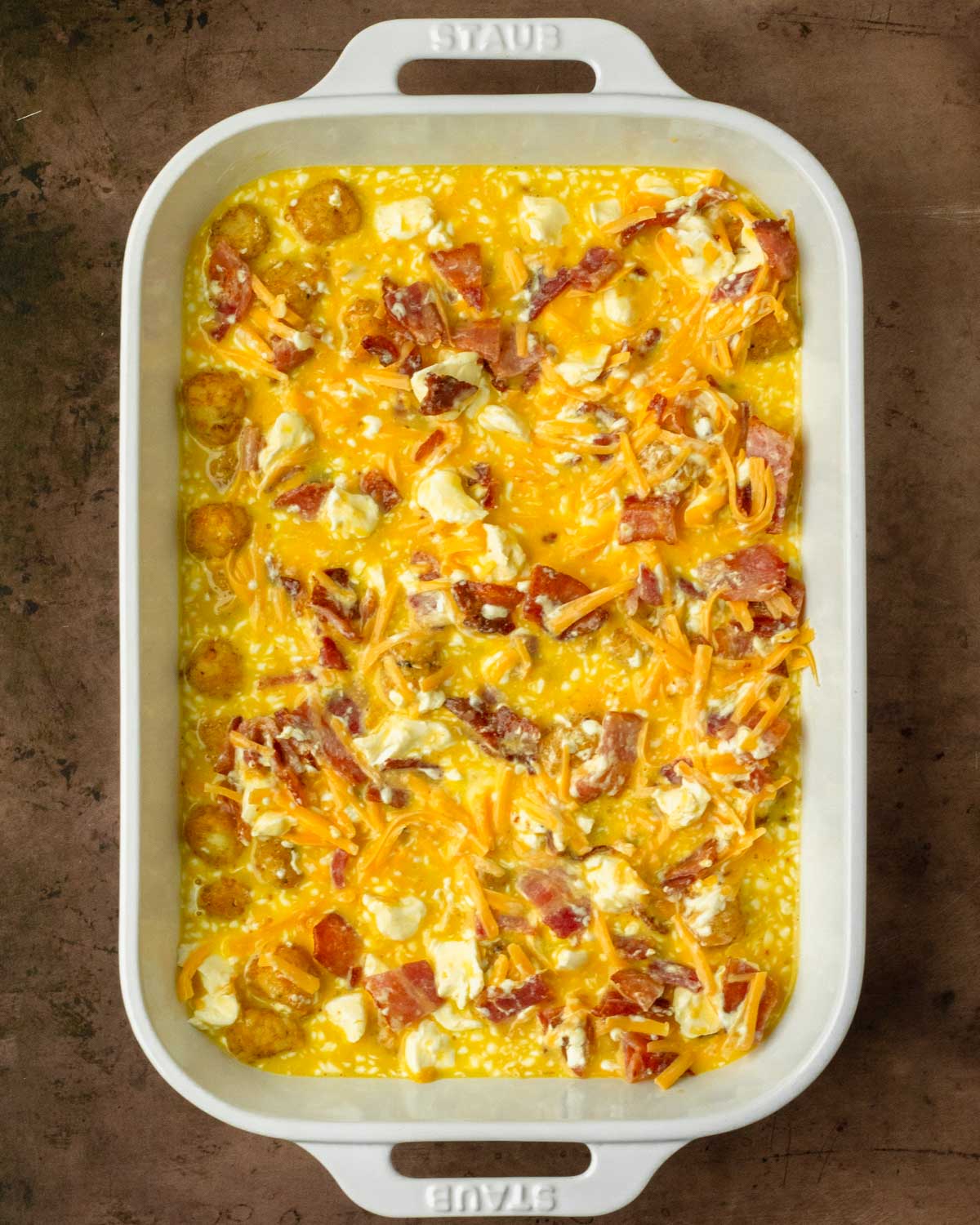 Step 2. Pour the egg mixture over the tater tots