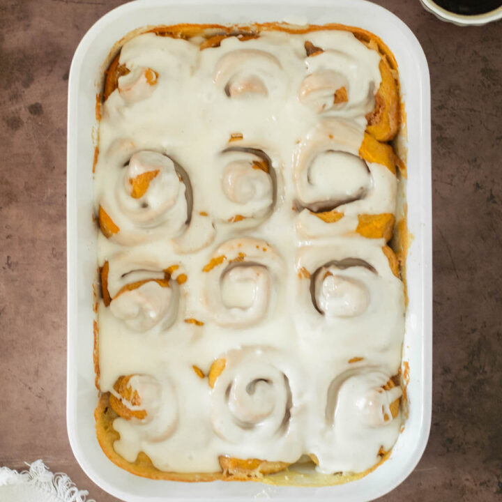 These pumpkin cinnamon rolls are the best classic soft and fluffy pumpkin cinnamon rolls made with pumpkin puree and fall spices, filled with a gooey cinnamon sugar filling and topped with a delicious cream cheese frosting.