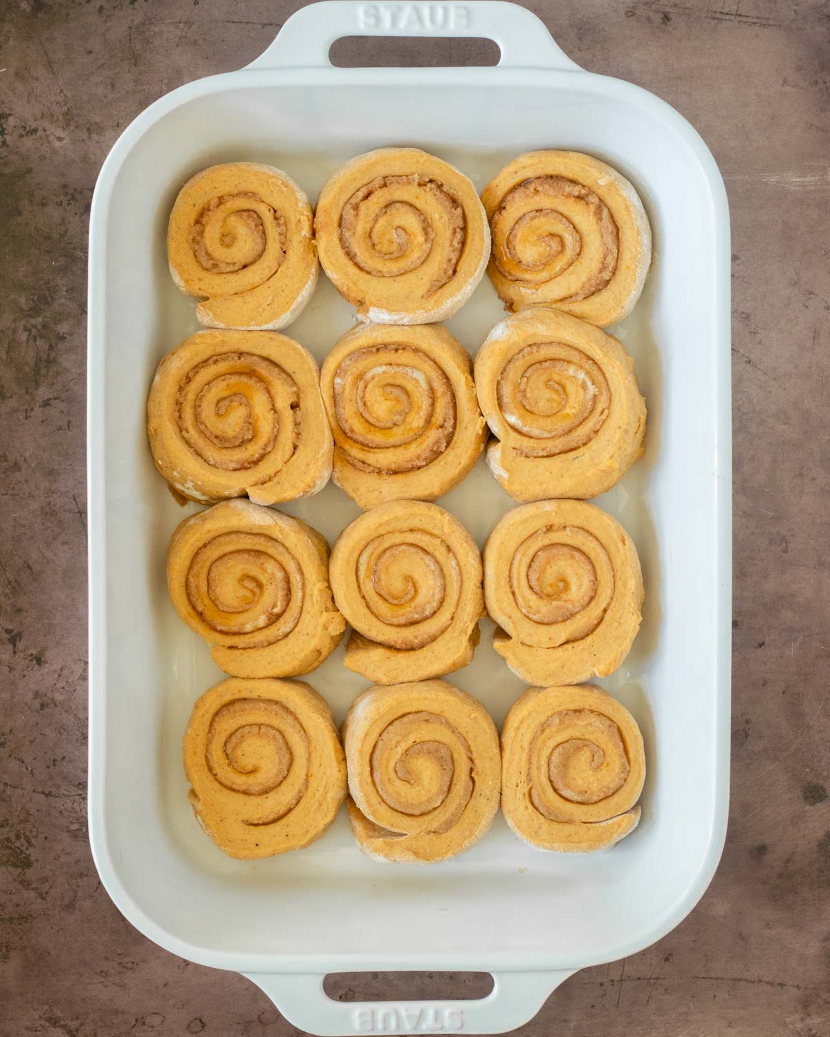 Step 2. Assemble the pumpkin cinnamon rolls and place in a baking dish